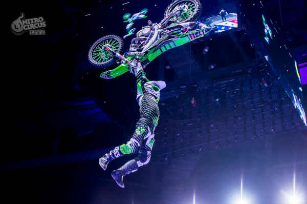 Image of a motorcylce rider mid trick.